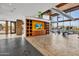 Well-equipped gym with modern machines, bright lighting, and built-in shelving with a mounted television at 826 E Buist Ave, Phoenix, AZ 85042