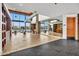 Well-lit gym featuring modern exercise equipment, high ceilings, and floor-to-ceiling windows with scenic views at 826 E Buist Ave, Phoenix, AZ 85042