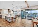 Open-concept kitchen features large island, backyard view, hardwood floors, and modern appliances at 826 E Buist Ave, Phoenix, AZ 85042