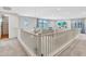 Upstairs loft area with large windows and neutral carpet at 826 E Buist Ave, Phoenix, AZ 85042