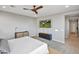 Comfortable main bedroom with wood fan and smart TV at 826 E Buist Ave, Phoenix, AZ 85042
