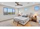 Bright main bedroom with large window and minimalist decor at 826 E Buist Ave, Phoenix, AZ 85042