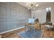 Home office features stylish wall accents, hardwood floors, and a modern light fixture at 826 E Buist Ave, Phoenix, AZ 85042