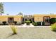 Charming single-story home with a well-maintained front yard and gated entry at 10468 W Palmeras Dr, Sun City, AZ 85373