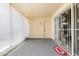 Enclosed patio with security screen and privacy shades creating a comfortable space at 10468 W Palmeras Dr, Sun City, AZ 85373