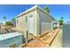 Cozy mobile home with neutral siding, white trim, brick skirting, and a well-maintained yard, nestled in a tidy neighborhood at 111 S Greenfield Rd # 547, Mesa, AZ 85206