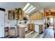 Well-lit kitchen featuring skylights, wood cabinets, laminate countertops, and modern appliances at 111 S Greenfield Rd # 547, Mesa, AZ 85206