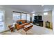 Living room with a fireplace, leather sofa, three windows providing great natural lighting at 111 S Greenfield Rd # 547, Mesa, AZ 85206