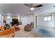 Spacious living room with a fireplace, ceiling fan, and a leather sofa for relaxing at 111 S Greenfield Rd # 547, Mesa, AZ 85206