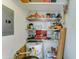 Utility room with shelves, a water heater, and extra storage space with a few electric outlets at 111 S Greenfield Rd # 547, Mesa, AZ 85206