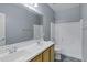 Bright bathroom boasts double sinks, bathtub/shower combo, and patterned floors at 1272 W Joshua Tree Ave, Queen Creek, AZ 85140