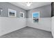 Bedroom featuring wainscoting and lots of natural light from many windows at 1272 W Joshua Tree Ave, Queen Creek, AZ 85140