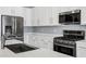 Kitchen featuring stainless steel appliances, plenty of counter space and modern finishes at 1272 W Joshua Tree Ave, Queen Creek, AZ 85140