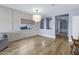 Bright living room featuring wood floors, neutral walls, and modern lighting fixtures at 1272 W Joshua Tree Ave, Queen Creek, AZ 85140