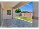 A covered outdoor patio offers a great space with room to relax and entertain in this desert home at 1272 W Joshua Tree Ave, Queen Creek, AZ 85140