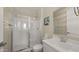 Clean bathroom featuring a glass-enclosed shower and modern vanity, providing a refreshing space at 13820 W Weaver Ct, Litchfield Park, AZ 85340