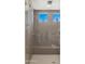 Modern bathroom shower with dual shower heads and natural light at 13820 W Weaver Ct, Litchfield Park, AZ 85340