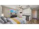 Well-lit bedroom featuring a kitchenette, modern decor, and ample natural light at 13820 W Weaver Ct, Litchfield Park, AZ 85340