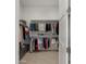 Spacious closet with organized hanging racks and shelving for clothes and shoes, offering ample storage solutions at 13820 W Weaver Ct, Litchfield Park, AZ 85340