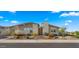 Well-maintained home exterior showcasing modern design, tasteful landscaping, and a welcoming facade under a clear blue sky at 13820 W Weaver Ct, Litchfield Park, AZ 85340