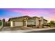 Charming single-Gathering home with modern architecture, a well-manicured yard, and a spacious two-car garage at 13820 W Weaver Ct, Litchfield Park, AZ 85340
