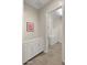 Laundry room with white cabinets, countertop, and appliances at 13820 W Weaver Ct, Litchfield Park, AZ 85340