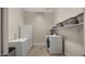 Laundry room with a washing machine, dryer, and freezer at 13820 W Weaver Ct, Litchfield Park, AZ 85340