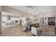 Expansive living area featuring tile floors, recessed lighting, and an open layout connecting to the kitchen at 13820 W Weaver Ct, Litchfield Park, AZ 85340