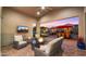 Inviting outdoor patio with comfortable seating, a fire pit, and outdoor television at 13820 W Weaver Ct, Litchfield Park, AZ 85340