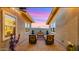 Beautiful patio with chairs and desert landscaping, perfect for enjoying the sunset in a private outdoor setting at 13820 W Weaver Ct, Litchfield Park, AZ 85340