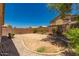 Gravel backyard with block wall and desert landscaping at 15460 W Mescal W St, Surprise, AZ 85379