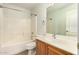 Bright bathroom with single sink vanity and shower-tub combo at 15460 W Mescal W St, Surprise, AZ 85379