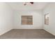 Bright bedroom features neutral colored carpet with natural light from two windows at 15460 W Mescal W St, Surprise, AZ 85379