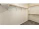 Walk in closet with shelving and carpet at 15460 W Mescal W St, Surprise, AZ 85379