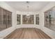 Bright dining area featuring wood floors and a bay window that offers natural light and neighborhood views at 15460 W Mescal W St, Surprise, AZ 85379
