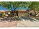 Charming single-story home with a two-car garage and mature trees in a well-maintained neighborhood at 15460 W Mescal W St, Surprise, AZ 85379