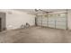 Spacious two car garage with bright white walls and concrete floor at 15460 W Mescal W St, Surprise, AZ 85379