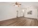 Open-concept living area featuring durable flooring, fresh neutral paint and a ceiling fan at 15460 W Mescal W St, Surprise, AZ 85379