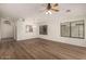 Bright open-concept living space with durable flooring, ceiling fan, and ample natural light at 15460 W Mescal W St, Surprise, AZ 85379