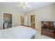 Comfortable bedroom boasts neutral walls, soft carpet and two access doors at 15960 W Indigo Ln, Surprise, AZ 85374