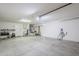 Spacious garage with bright lighting and a convenient electric vehicle charging station at 15960 W Indigo Ln, Surprise, AZ 85374