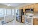 Well-lit kitchen with stainless steel appliances, white cabinetry, and a cozy breakfast nook at 15960 W Indigo Ln, Surprise, AZ 85374