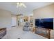 Spacious living area seamlessly connecting the kitchen and dining space, ideal for entertaining at 15960 W Indigo Ln, Surprise, AZ 85374