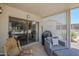 Covered patio is perfect for outdoor entertaining with ample seating and a grill at 15960 W Indigo Ln, Surprise, AZ 85374