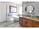 Bathroom features include a freestanding tub, dual mirrors, and custom cabinetry at 16645 W Papago St, Goodyear, AZ 85338
