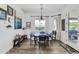 Cozy dining area with a dark wood table, comfortable chairs, and natural light at 16645 W Papago St, Goodyear, AZ 85338