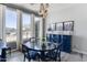 Bright dining room features large windows with backyard views and a stylish, blue buffet cabinet at 16645 W Papago St, Goodyear, AZ 85338