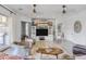 Bright and airy living room with hardwood floors, modern seating, and views to the exterior at 16645 W Papago St, Goodyear, AZ 85338