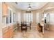 Charming breakfast nook with shuttered windows and adjacent desk space, creating a functional and bright area at 16857 W Villagio Dr, Surprise, AZ 85387