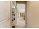 Hallway featuring tile floor, and bedroom and living room views at 16857 W Villagio Dr, Surprise, AZ 85387